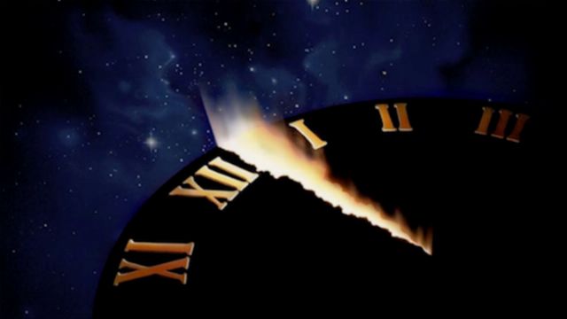 A celestial clock with Roman numerals partially illuminated by a radiant light, set against a backdrop of a deep celestial field with visible stars. Opens a new window with the video.