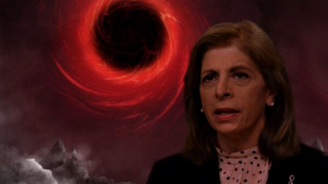 A composed portrait of a woman with focused expression in business attire overlaid on a dramatic cosmic background featuring a swirling red nebula and mist-shrouded mountainous terrain. Opens a new window with the video.