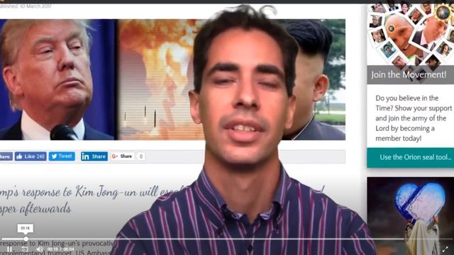 A split-screen image featuring a man in a striped shirt on the right, speaking during a news report. On the left, there&rsquo;s a still of a political figure with a solemn expression. The background includes a blurred news studio setting and various social media sharing icons are visible at the bottom. Opens a new window with the video.