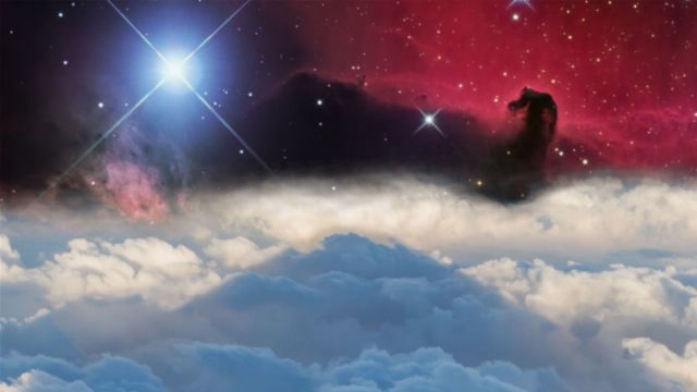 A vibrant celestial scene with a nebula in shades of red and cluster of stars illuminating the background. A silhouette resembling a figure from the Mazzaroth stands atop a layer of soft, blue-white clouds. Opens a new window with the video.