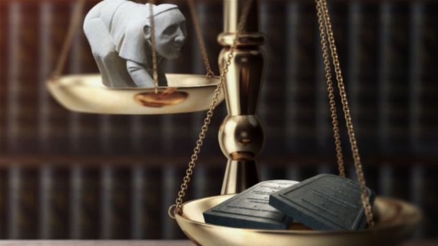 A symbolic depiction featuring a golden balance scales, on one side is an image of a contemplative elderly man, and on the other side are inscribed tablets. The background shows a blurred library of books, suggesting a thematic exploration of wisdom or judgment. Opens a new window with the video.