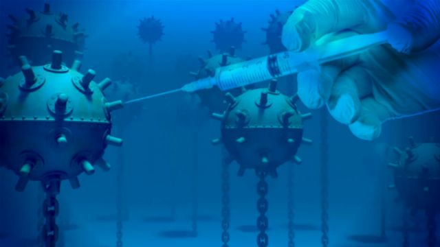 A surreal illustration showing a gloved hand holding a syringe, injecting a fluid into a spherical structure adorned with protrusions, resembling a virus. Several similar structures are suspended in the background, all set against a deep blue backdrop. Opens a new window with the video.