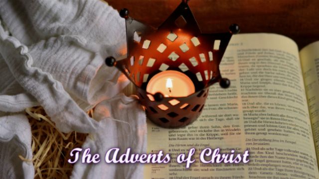 A lit candle housed in a decorative metal lantern rests on an open book next to a white cloth and straw, with the text &ldquo;The Advents of Christ&rdquo; overlaid on the image. Opens a new window with the video.