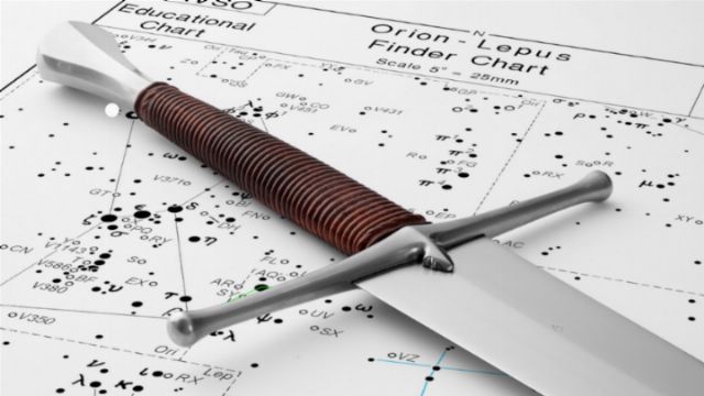 A dagger with a wrapped leather handle rests on a celestial navigation chart featuring constellations such as Orion and Lepus, depicted with star connections and coordinate points. Opens a new window with the video.