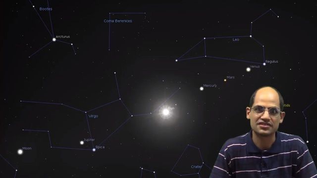 A man with glasses, wearing a striped shirt, appears in front of a digital backdrop depicting a starry sky map with labeled celestial bodies and constellations, including the brighter stars and planets like Mars, Mercury, and Jupiter. Opens a new window with the video.