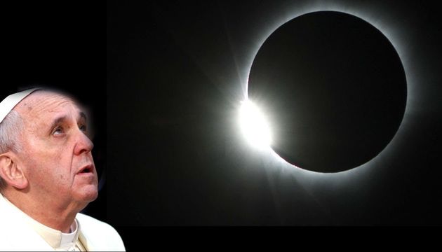 A man in religious attire gazing upward in awe at a solar eclipse, capturing the dramatic moment when the moon aligns perfectly with the sun, revealing the bright solar corona. Opens a new window with the video.