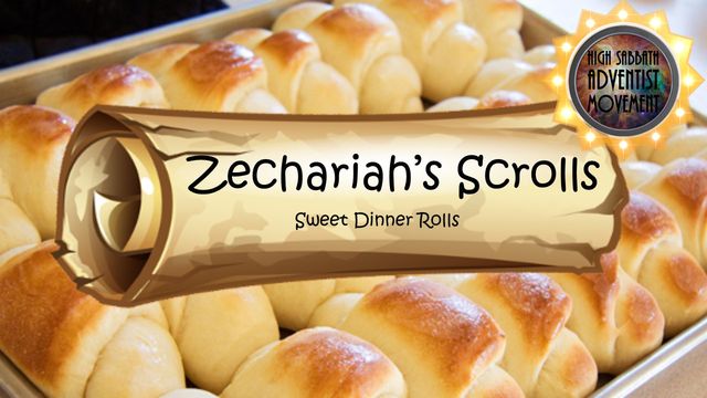 A tray of golden-baked sweet dinner rolls named &ldquo;Zechariah's Scrolls&rdquo; displayed prominently. The rolls are arranged neatly in a metal baking tray and appear soft and fluffy, embodying a tempting appearance suitable for a delightful meal accompaniment. Opens a new window with the video.