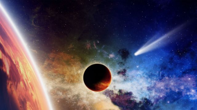 A vibrant depiction of celestial bodies, featuring a fiery comet streaking toward a distant star, set against a multicolored swath of nebula. A planet casts a shadow upon its nearby celestial neighbor, all under the watchful gaze of the Mazzaroth. Opens a new window with the video.