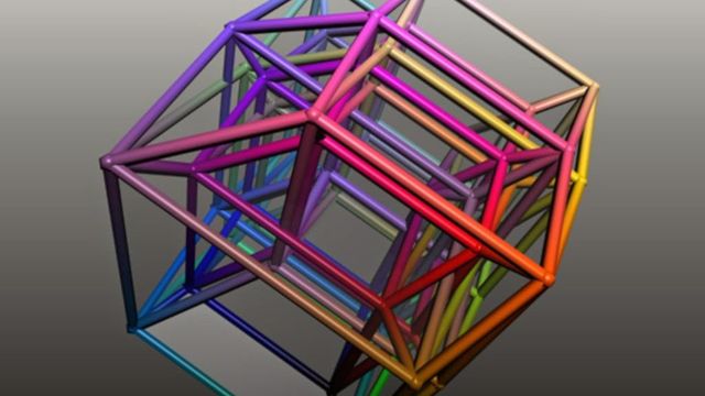 A 3D rendering of a complex, geometric structure resembling a nested tesseract or four-dimensional hypercube, displayed in multiple vibrant colors against a muted background. Opens a new window with the video.